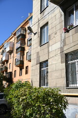 Architecture of old Soviet Union houses in Stalin's Empire style. Exterior of the facade of a vintage residential building in Russia