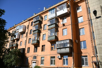 Architecture of old Soviet Union houses in Stalin's Empire style. Exterior of the facade of a vintage residential building in Russia
