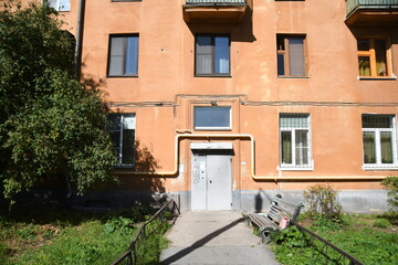 Architecture of old Soviet Union houses in Stalin's Empire style. Exterior of the facade of a vintage residential building in Russia