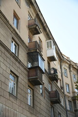 Architecture of old Soviet Union houses in Stalin's Empire style. Exterior of the facade of a vintage residential building in Russia