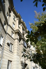 Architecture of old Soviet Union houses in Stalin's Empire style. Exterior of the facade of a vintage residential building in Russia