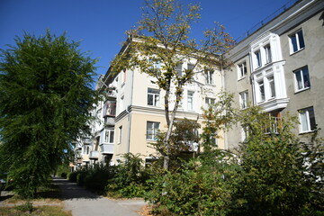 Architecture of old Soviet Union houses in Stalin's Empire style. Exterior of the facade of a vintage residential building in Russia