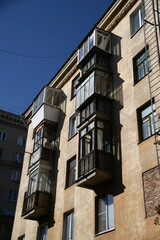 Architecture of old Soviet Union houses in Stalin's Empire style. Exterior of the facade of a vintage residential building in Russia