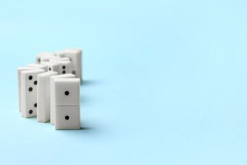 White dominos blocks in shape of zigzag on blue background