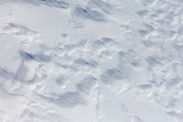 The snow is white and the sky is blue