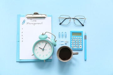 Clipboard with text TIME MANAGEMENT, alarm clock, cup of coffee and stationery on color background