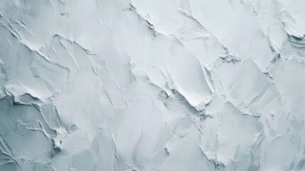 Obraz premium Textured rough plaster wall surface in soft gray tones suitable for backgrounds, artistic projects, and interior design applications