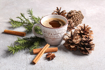 Pine cones with fir branches, cinnamon and cup of coffee on white background