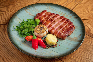 juicy steak with herbs and pepper