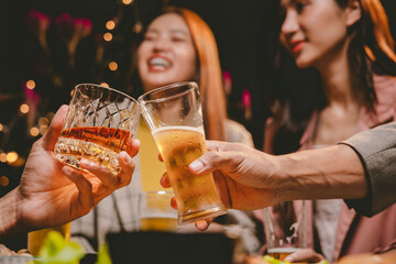 A cheerful group of friends enjoying wine and food on a sunny patio. Toasting with wineglasses, they celebrate togetherness in a scenic outdoor setting, blending fun, friendship, and a festive mood.