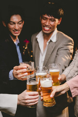 A cheerful group of friends enjoying wine and food on a sunny patio. Toasting with wineglasses, they celebrate togetherness in a scenic outdoor setting, blending fun, friendship, and a festive mood.