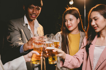 A cheerful group of friends enjoying wine and food on a sunny patio. Toasting with wineglasses, they celebrate togetherness in a scenic outdoor setting, blending fun, friendship, and a festive mood.