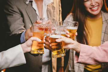 A cheerful group of friends enjoying wine and food on a sunny patio. Toasting with wineglasses, they celebrate togetherness in a scenic outdoor setting, blending fun, friendship, and a festive mood.