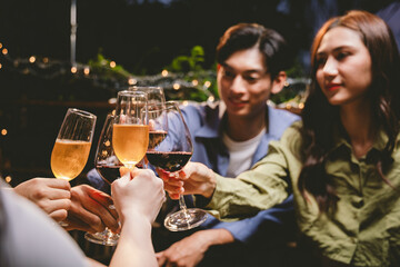 A lively group of friends enjoying beers at a festive pub, toasting with frosty pints. The scene captures the joy of friendship, culture, and celebration over drinks and appetizers on a sunny terrace.
