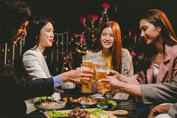 A lively group of friends enjoying beers at a festive pub, toasting with frosty pints. The scene captures the joy of friendship, culture, and celebration over drinks and appetizers on a sunny terrace.