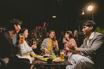 A lively group of friends enjoying beers at a festive pub, toasting with frosty pints. The scene captures the joy of friendship, culture, and celebration over drinks and appetizers on a sunny terrace.