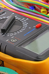 A digital multimeter for measuring the parameters of electrical circuits. Close-up. Soft focus.