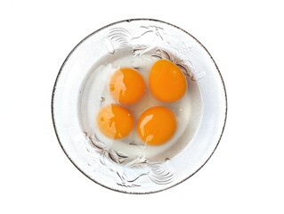 Egg yolk in bowl isolated on white background 