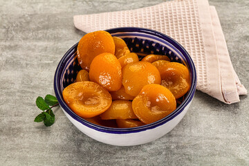 Sweet canned apricots with syrope