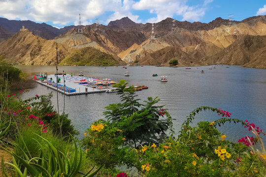Al Rafisah Dam, Khor Fakkan, UAE Al Rafisah Water Dam is tourist attraction place for water adventure family activities like rental boat safari, kayaking, water bikeThe lake in the desert and mountain