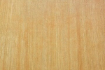 Naklejka premium This close-up image depicts a smooth wooden surface featuring subtle grain patterns, perfect for showcasing elegance and the natural beauty of wood in interior design applications.