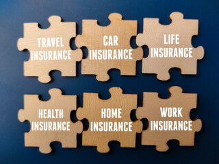 Top view wooden puzzle with insurance concept on a blue background. Business and insurance concept