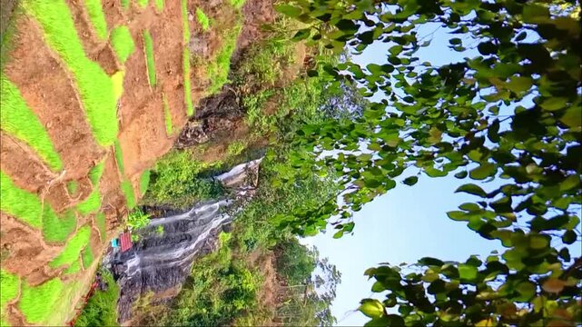 Vertical static shot of Curug Cikondang waterfall in Cianjur, West Java, Indonesia