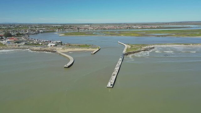 Mouth of Berg River, harbor structure and anchored fishing boats. Aerial