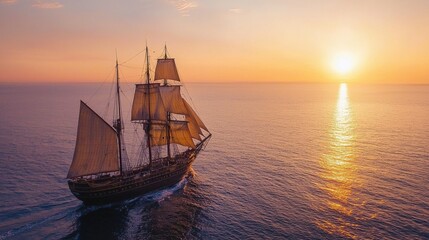 Obraz premium A majestic sailing ship glides across calm waters at sunset, with vibrant colors illuminating the sky and reflecting on the ocean surface.