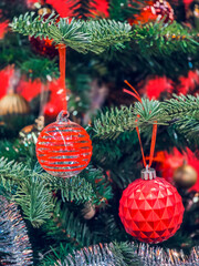 Christmas tree decorated with beautiful ornaments,celebrate the christmas season with vintage style. garland background and xmas wallpaper.