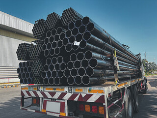Construction products on transport vehicles Group of steel pipes for industrial materials...