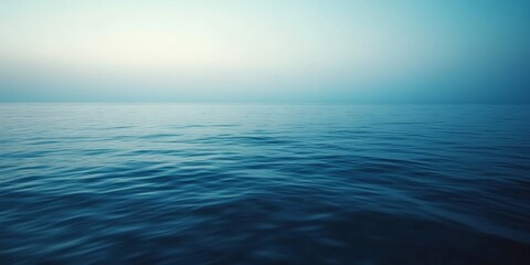 Obraz premium Serene sea at dusk, showcasing the tranquil beauty of the peaceful sea during late evening hours, perfect for evoking feelings of calm and relaxation associated with the peaceful sea.