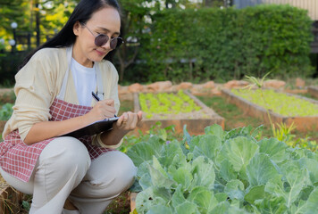 Woman, farmer and checklist in outdoor portrait, writing notes and review produce quality