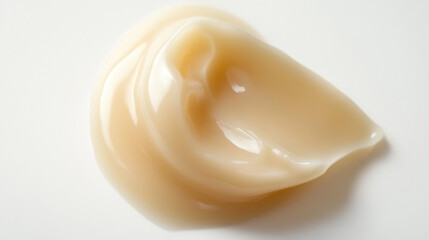 A Smooth and Glossy Cream Texture Spread on a White Surface, Ideal for Cosmetic, Personal Care, and Product Use in Advertising or Digital Media