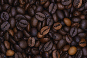 beautiful picture, background with coffee beans, close-up of spilled coffee, a mixture of robusta and Arabica