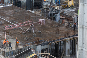 Construction workers fabricating steel reinforcement bar at the construction site