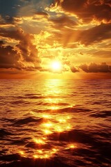 Obraz premium Golden Sunset with Cloudy Sky Over Ocean