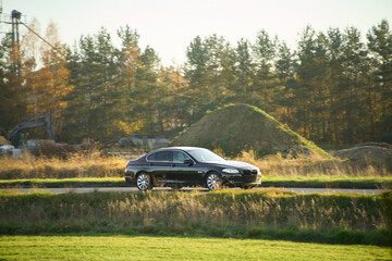 Fototapeta premium Stylish car in rural outdoor setting