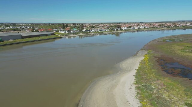 Aerial flying over Berg River, cityscape and private jetties, Velddrif, South Africa