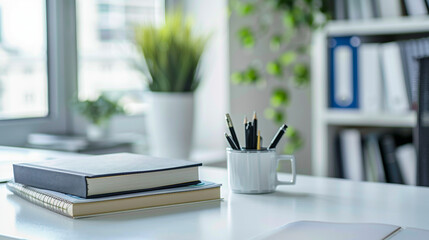 A minimalist study room with a white table covered in books and stationery, offering ample copy space for creative work, perfect for students and professionals looking to organize their workspace.