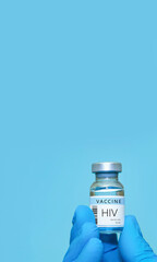 A doctor holds a vial of the HIV vaccine. Experimental HIV vaccine vial for immunization against HIV disease. Copy space