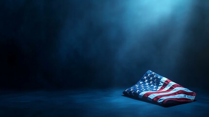 A solemn tribute featuring a folded American flag surrounded by soft light on a dark blue backdrop