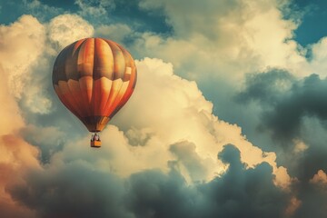 Fototapeta premium A hot air balloon soaring through a cloudy sky, perfect for adventure or travel scenes