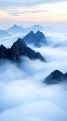 Obraz premium Aerial view of majestic mountain peaks in serene foggy landscape