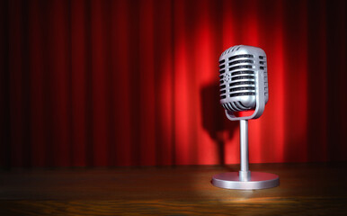 Vintage microphone on stage with red curtains