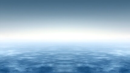 Obraz premium A serene blue ocean scene, showcasing a smooth, reflective water surface merging seamlessly with a soft, pastel sky, creating a tranquil and calm atmosphere.