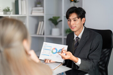 Professional Business Team Collaborating on Project Strategy and Analyzing Work Plans in Modern...