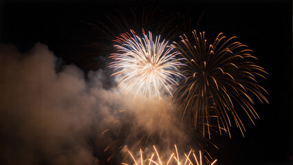 Vibrant Fireworks Celebration Illuminating the Night Sky with Smoke and Colorful Explosions