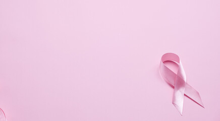 Pink ribbon on color background, top view. Cancer awareness Photo Formats