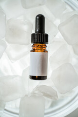 Dark brown dropper bottle isolated on white background